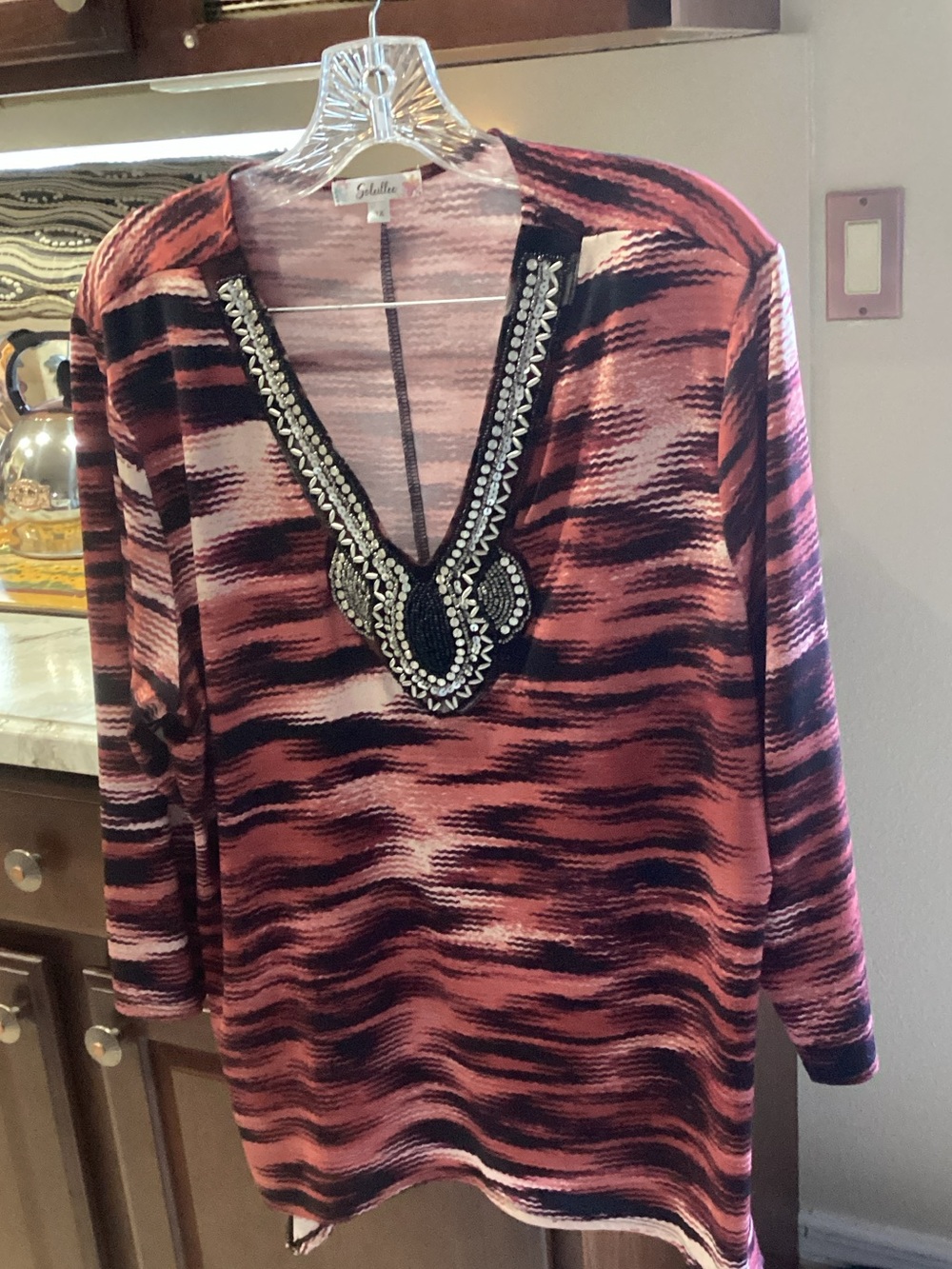 Embellished V-Neck Wave-Print Tunic in orange and black.